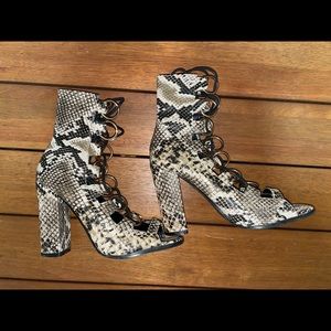 Snakeskin lace-up heels